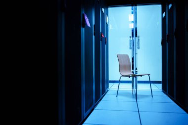 n empty chair in the server room represents a job title.