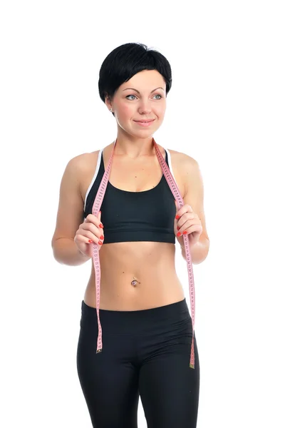 Portrait of young fitness woman with tape-line — Stock Photo, Image