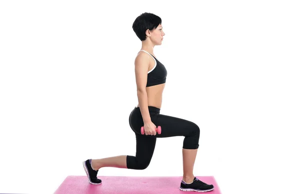 Portrait of young fitness woman with a dumbbells — Stock Photo, Image