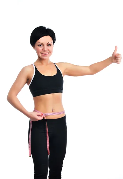 青年健身女人测量她的腰 — 图库照片