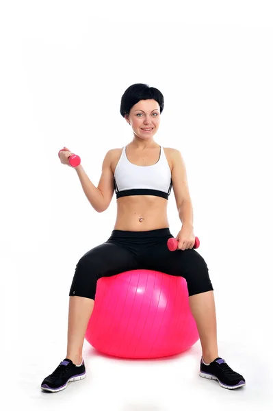 Fiatal nő, egy fitness labda — Stock Fotó