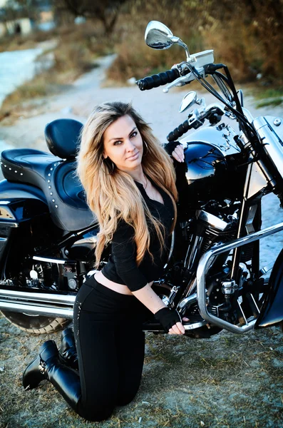 Young beautiful woman on a bike — Stock Photo, Image