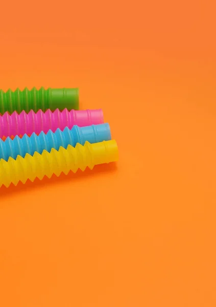 Bunte Trendige Spielzeuge Pop Tube Auf Dem Hintergrund — Stockfoto