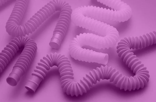 Bunte Trendige Spielzeuge Pop Röhren Trendigem Samt Violett Auf Hintergrund — Stockfoto