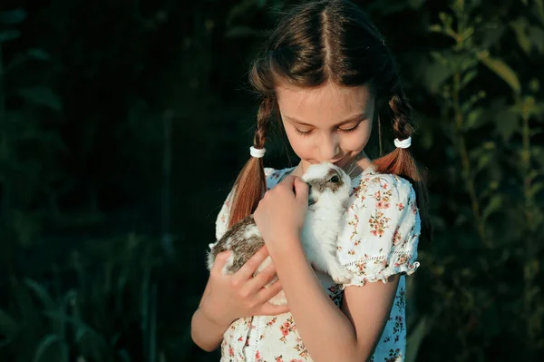 Girl Hugging Baby Rabbit Outdoors — Stock Photo, Image