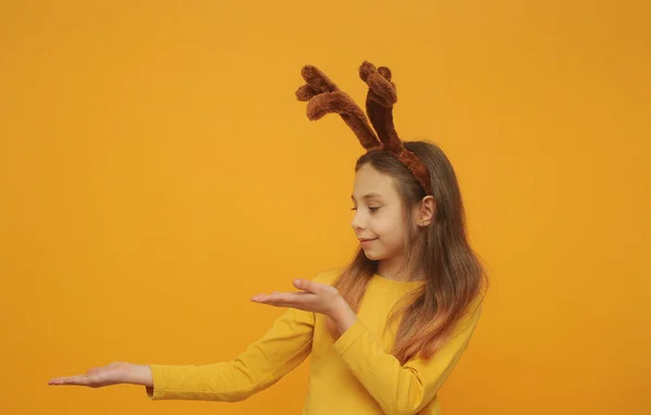 Funny Little Girl Deer Ears Posing Yellow Background Christmas Holiday — Fotografia de Stock