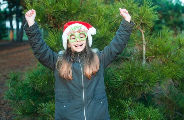 Little Girl Winter Park Smiling Girl Santa Hat Forest Has — Fotografia de Stock