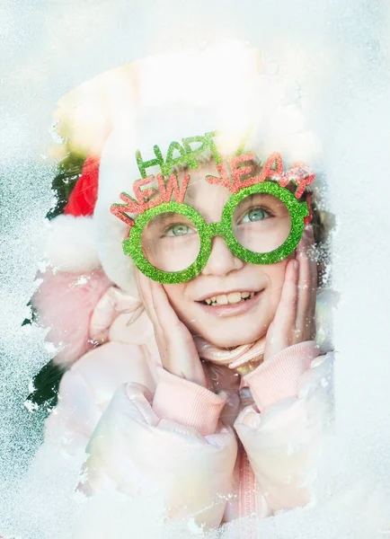 Girl Santa Claus Costume Looking Throught Snowy Window — Stock Fotó