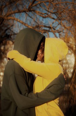 couple on the beach, enjoying the sunset, on a sunny day 