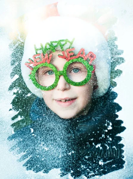 Boy Santa Claus Costume Looking Throught Snowy Window Happy New — Stock Fotó