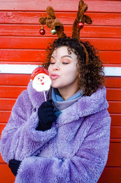 Portrait Smiling Woman Winter Clothes Deer Ears Holding Christmas Candy — Fotografia de Stock