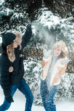  family playing on the snow in winter park