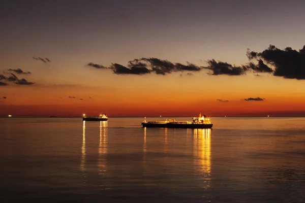 Ship at anchor durint sunset — Stock Photo, Image