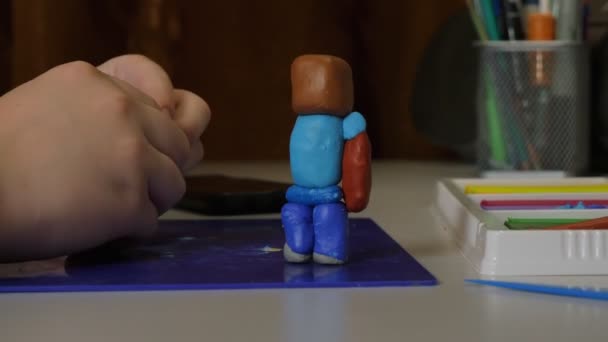 Boy Makes Hand Made Craft Plasticine Plasticine Man — Stock Video