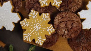 Homemade gingerbread cookies on Christmas Eve. Gingerbread cookies on a wooden table. Family and holidays concept