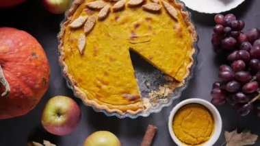 Pumpkin and pumpkin pie. Happy Thanksgiving wooden table. Pumpkin pie. Festive scene of autumn festival, fall. View from above. 4K