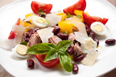 Tuna salad with beans, pepper, tomatoes and eggs clipart