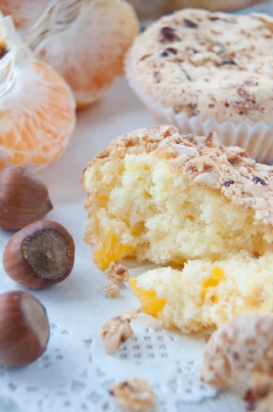 Homemade muffins with nuts and mandarins — Stock Photo, Image