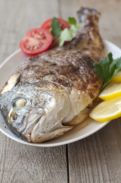 Fried (roasted) Fish (Dorado) Garnished with Lemon, Tomato — Stock Photo, Image