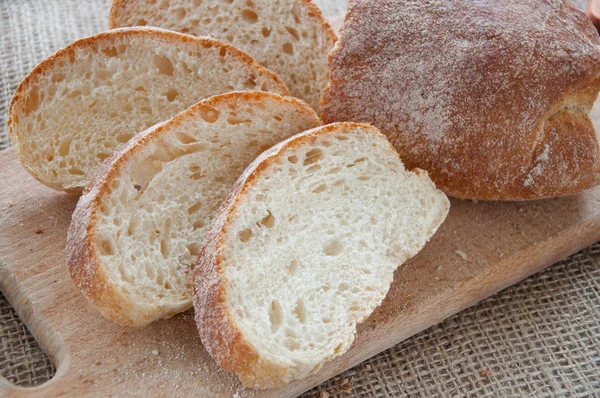 Sliced ciabatta bread on the board — Stock Photo, Image