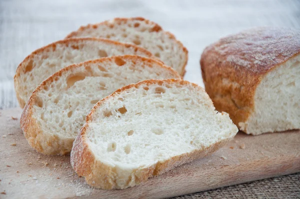 Sliced ciabatta bread on the board — Stock Photo, Image