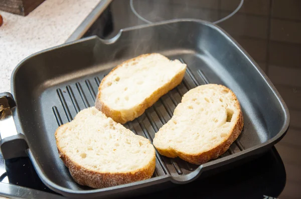 Thick slices of freshly baked garlic bread seasoned with butter — Stock Photo, Image