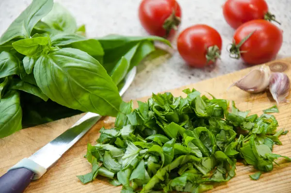 Preparing Bruschetta. Ingredients for preparation:ciabatta,oil, tomato, garlic, basil — Stock Photo, Image