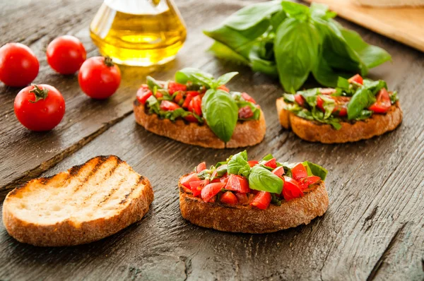 Italian tomato bruschetta with chopped vegetables — Stock Photo, Image