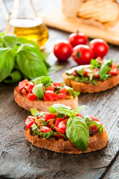 Italian tomato bruschetta with chopped vegetables — Stock Photo, Image