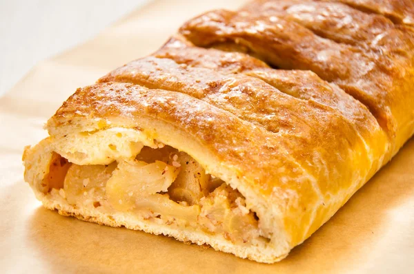 Slice of an apple strudel on the table — Stock Photo, Image