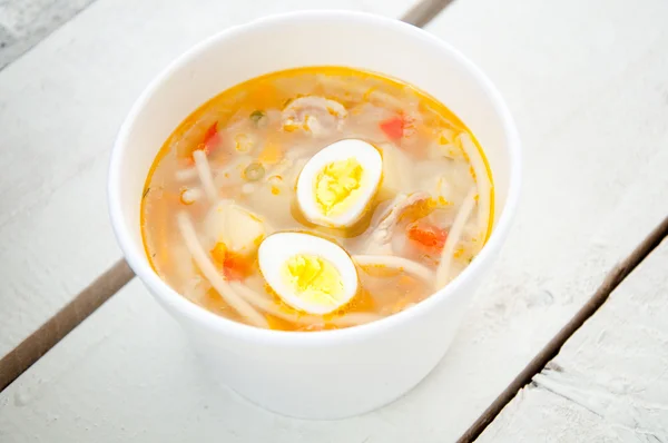 Chicken soup with noodles and boiled eggs — Stock Photo, Image