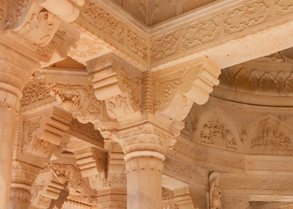 Extensive artful carving in amber sandstone inside cremation pav — Stock Photo, Image