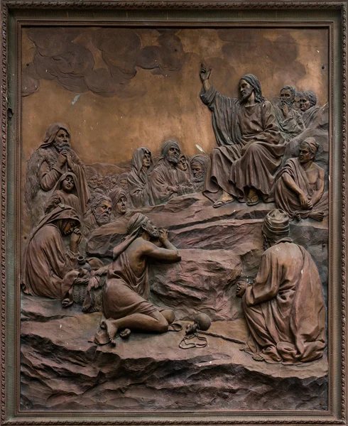 Bas-relief of Jesus preaching on the mount. Royalty Free Stock Photos