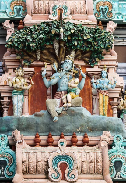 Murugan, Shiva's son, sitting on his knee. — Stock Photo, Image