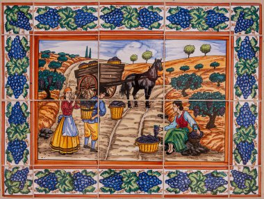 Temecula, CA, USA - 12 Nisan 2022: Europa Village. Fayans boyama, şarap yapımının 6 'da 2' si. Sıcak renkler 3 haneli rakamları ve at arabalarını gösteriyor. Asma üzümlerin mavi sınırı.