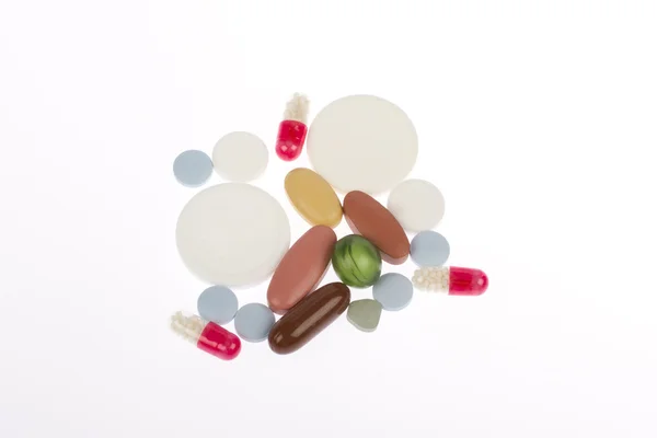 Gyógyszerek, tabletták különböző színű színben — Stock Fotó