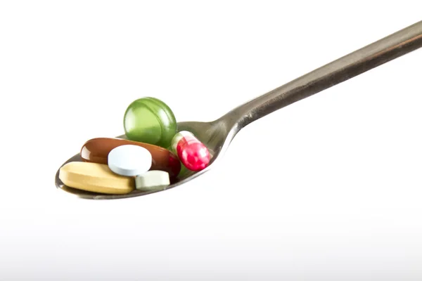 Drogas, pílulas em cores diferentes — Fotografia de Stock