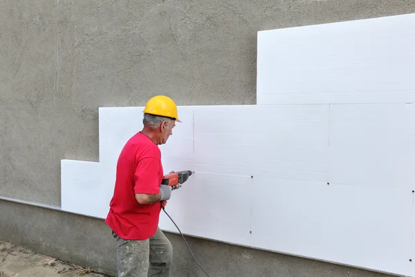 Construction site, styrofoam insulation drill — Stock Photo, Image