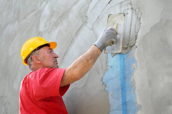 Aislamiento de pared, difusión de mortero sobre malla —  Fotos de Stock