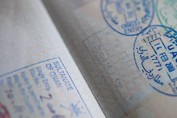 UAE and Oman stamps in the passport.