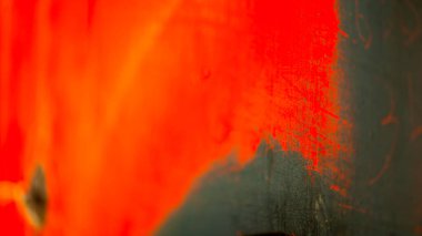Rusty and dirty metal surface with old red paint.