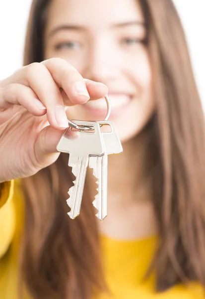 Attractive young woman holding keys — Stock Photo, Image