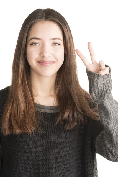 Happy young woman showing victory gesture — Stock Photo, Image