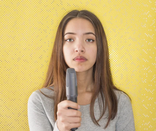 Attractive female reporter holding microphone
