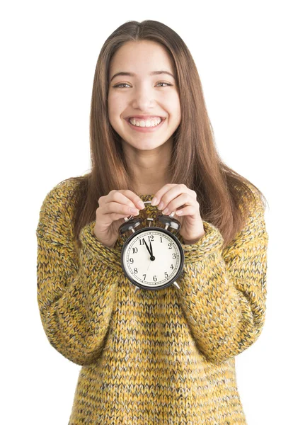 Attractive young woman holding alarm clock — Stock Photo, Image