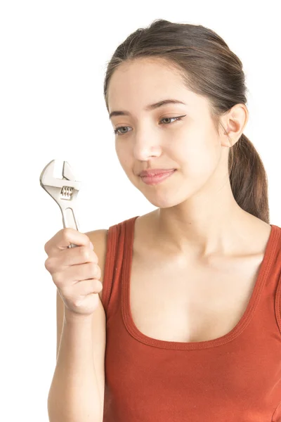 Attractive young woman holding monkey wrench — Stock Photo, Image