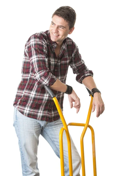 Smiling man with cart used for transport — Stock Photo, Image