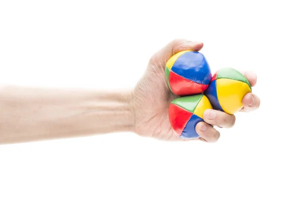 Hand holding three juggling balls — Stock Photo, Image