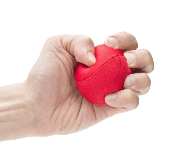 Hand squeezing red ball — Stock Photo, Image