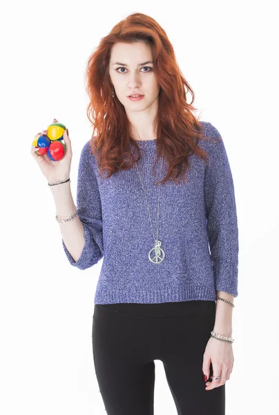 Pretty young female juggling balls — Stock Photo, Image